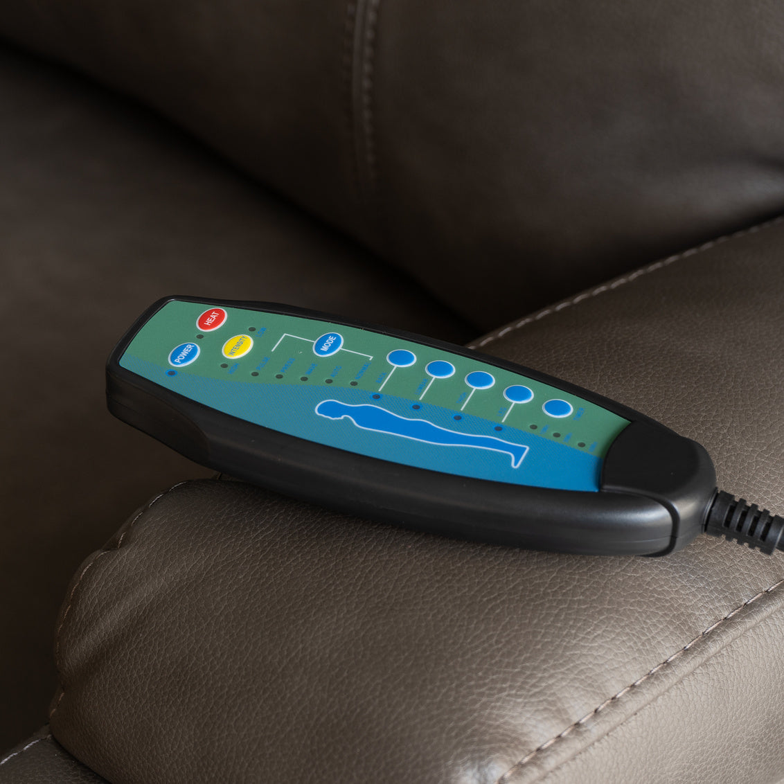 a remote control on a leather couch