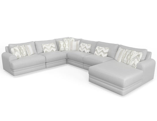 a large sectional sofa with pillows