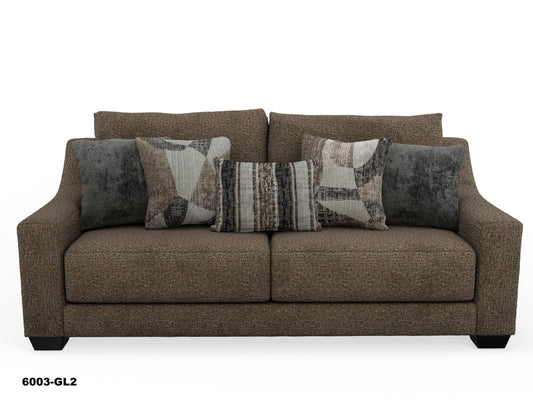 a brown couch with pillows