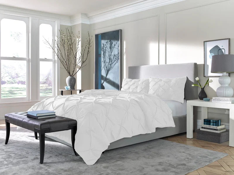 a bedroom with a bed and a bench